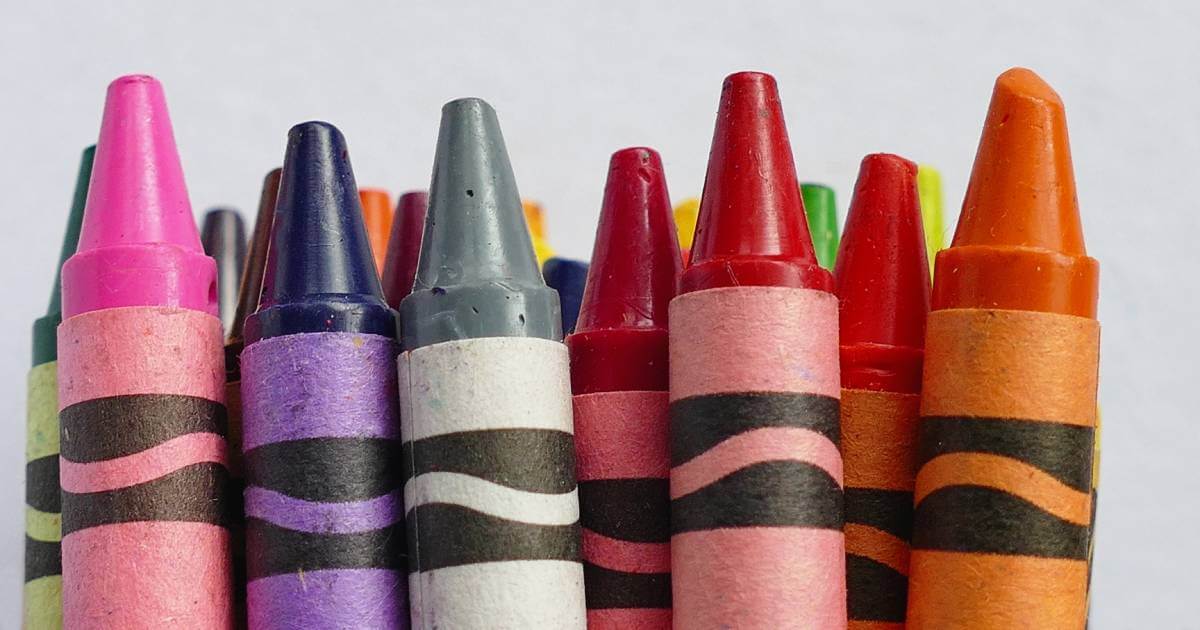 children coloring with crayons